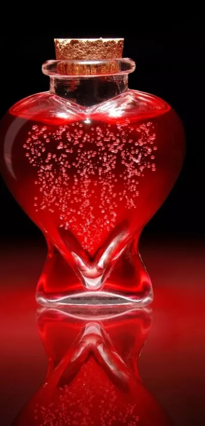 Heart-shaped red glass bottle with bubbles against black background.