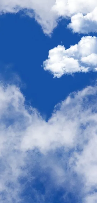 Heart-shaped cloud formation in vibrant blue sky.