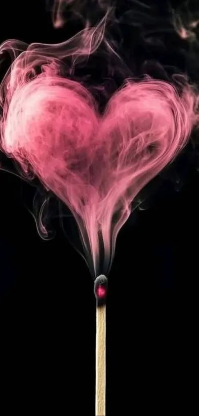 Heart-shaped pink smoke on a matchstick with black background.