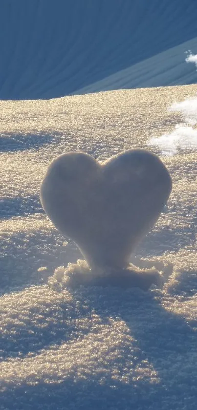 Heart-shaped snow sculpture in soft dawn light on textured snow.