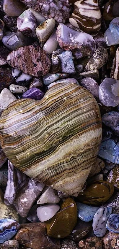 Heart-shaped stone on colorful rock background.