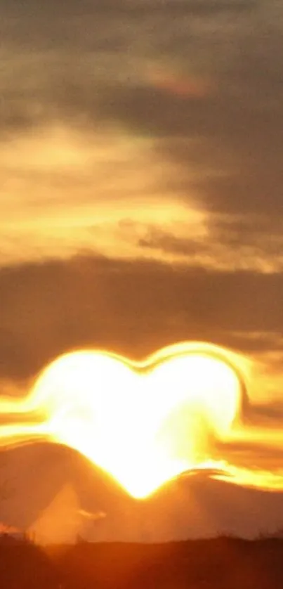 Heart-shaped sunset with golden hues in the sky.