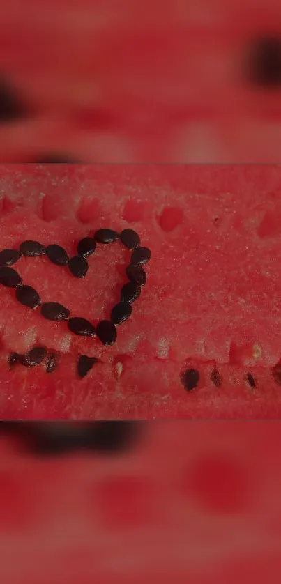 Heart-shaped watermelon seeds on a red slice background.