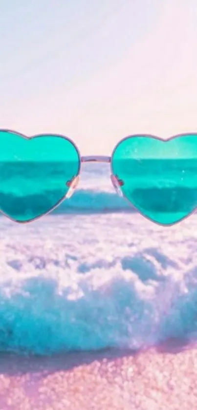 Heart-shaped sunglasses on a vibrant beach scene with pink skies.