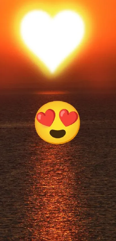 Heart-shaped sunset with emoji over ocean.