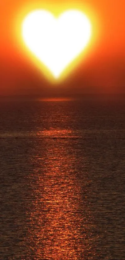 Heart-shaped sunset over ocean, creating a romantic evening view.