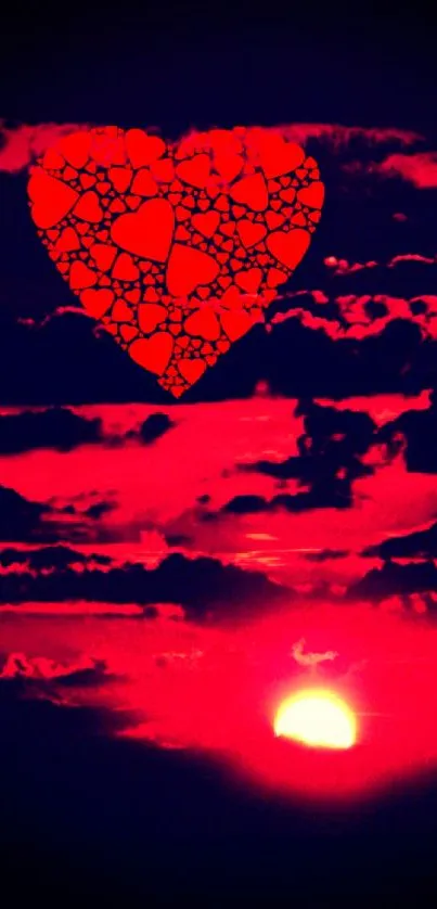 Vibrant heart above sunset in a red sky wallpaper.