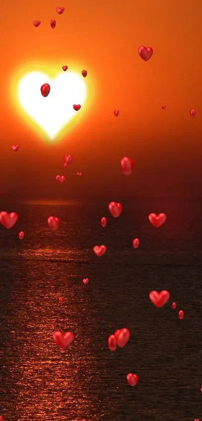 Heart-shaped sun setting over ocean in a warm, vibrant sunset.