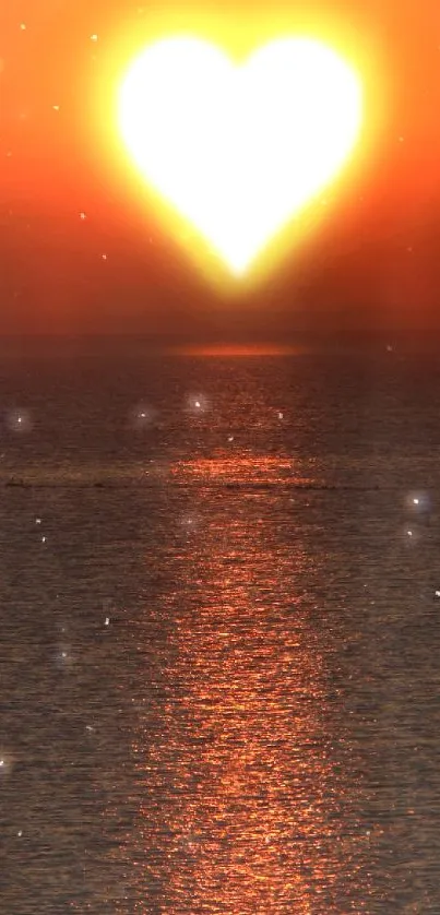 Heart-shaped sunset over ocean wallpaper with vibrant orange hues.