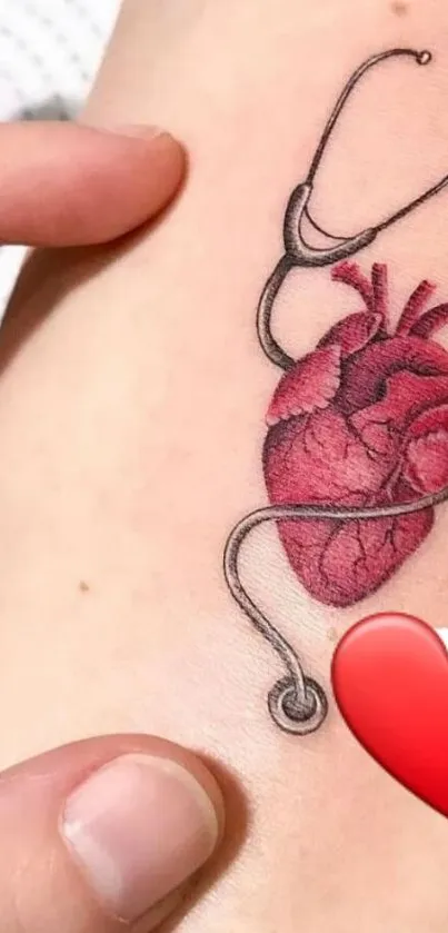 Heart tattoo with stethoscope on skin.