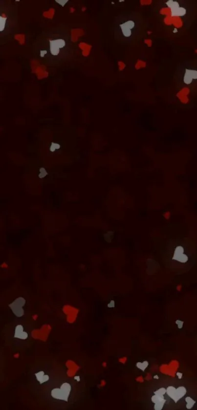 Dark wallpaper with scattered red and white hearts on black background.