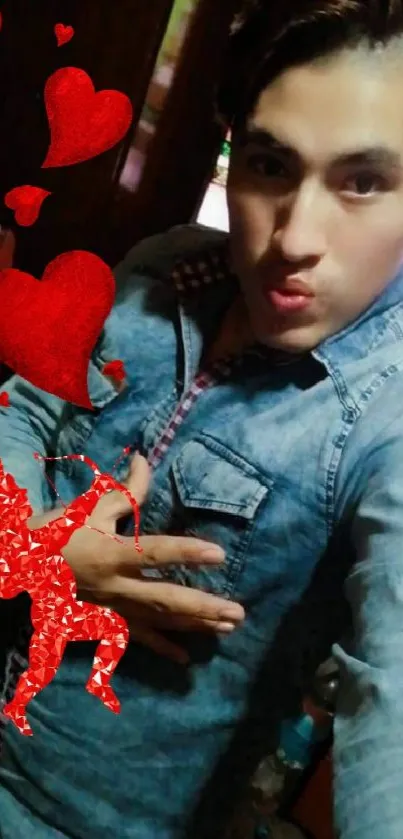 Denim shirt selfie with red hearts and cupid graphics.