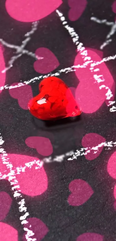 Vibrant red heart on a pink and black background featuring artistic design.