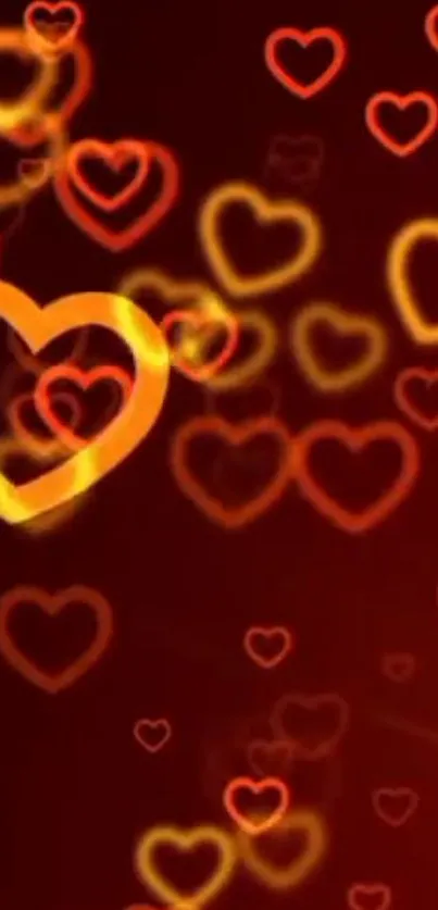 Vibrant wallpaper with red and orange heart outlines on a dark background.