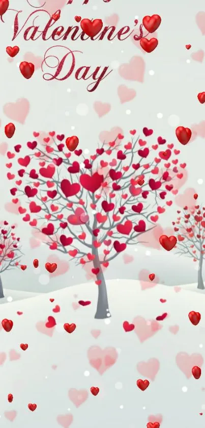 Heart-shaped trees with red leaves on snowy background.
