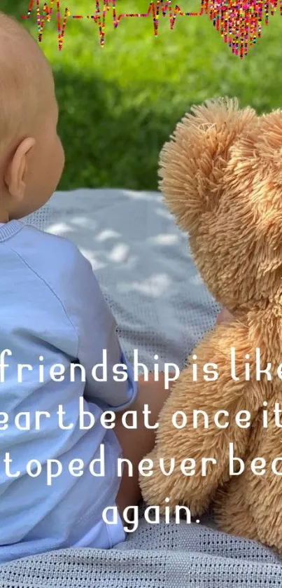 Baby with teddy bear on grass, friendship heartbeat theme.