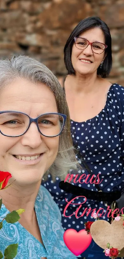 Heartfelt friendship wallpaper with two smiling women and a rose.