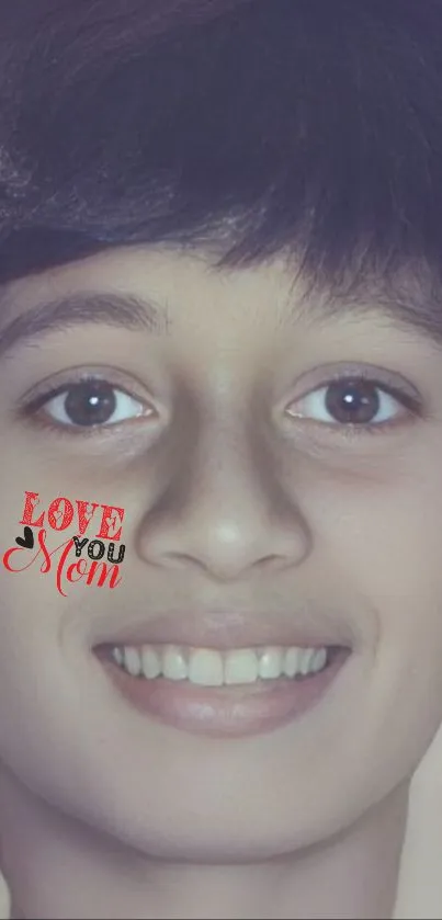 Smiling face with 'Love You Mom' text on cheek.