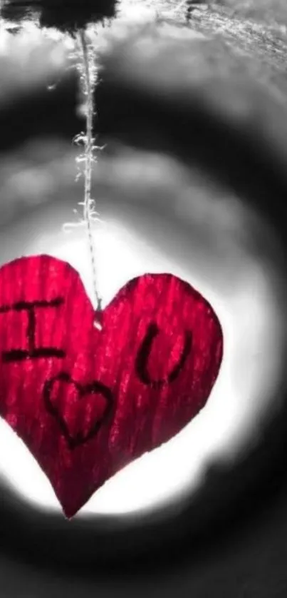 Red heart with I love you sign on mobile wallpaper.