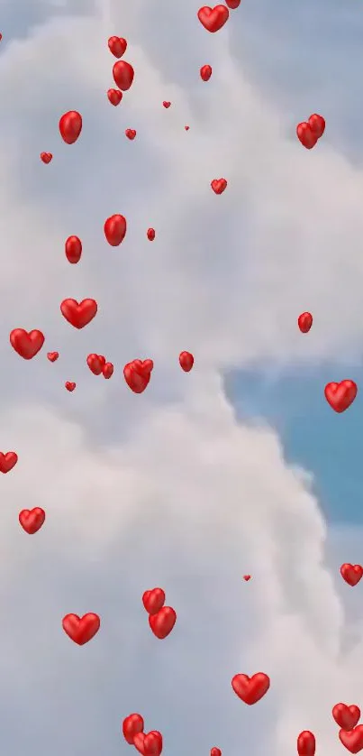 Red heart balloons floating in a light blue sky with fluffy clouds.