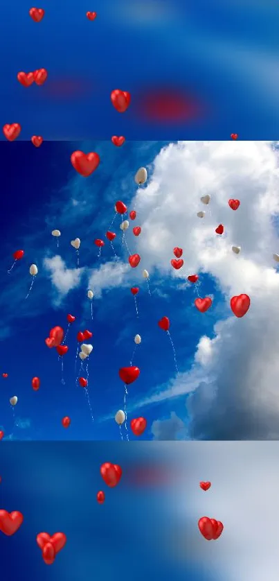Heart balloons float in a bright blue sky with fluffy white clouds.