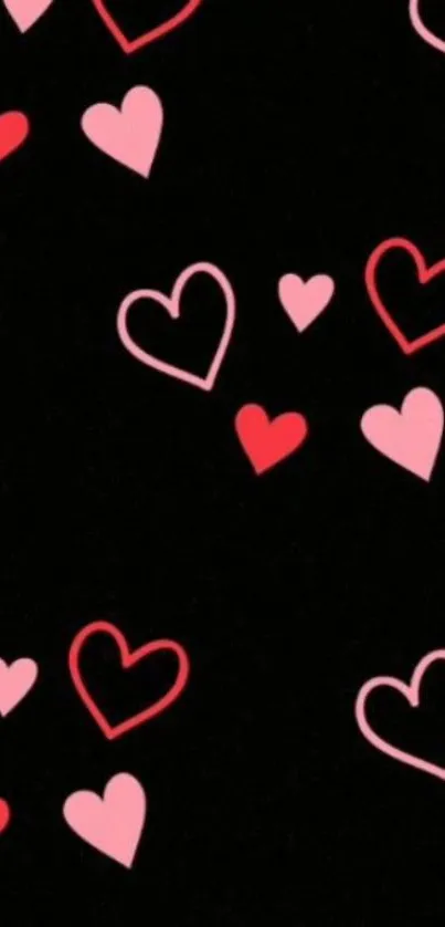 Black wallpaper with pink and red hearts.