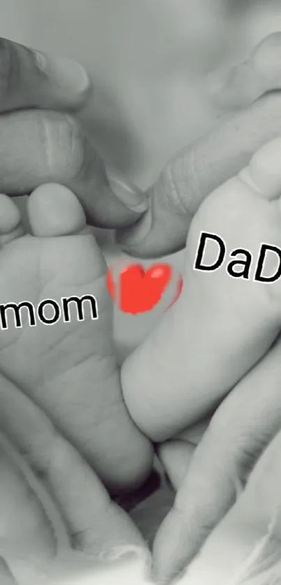 Monochrome heart-shaped family love wallpaper with baby feet and parental hands.