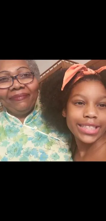 Smiling grandmother and granddaughter selfie.