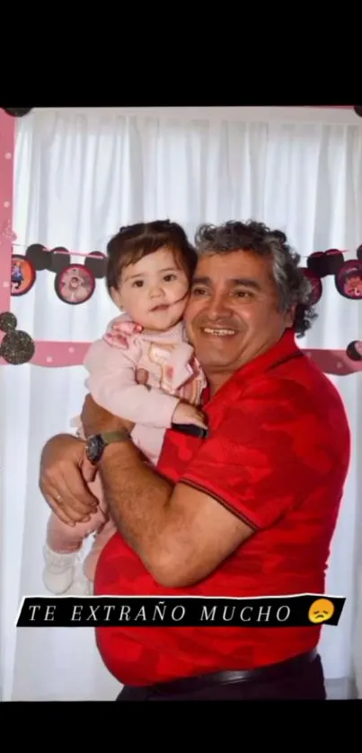 Grandfather holding granddaughter, joyful moment.