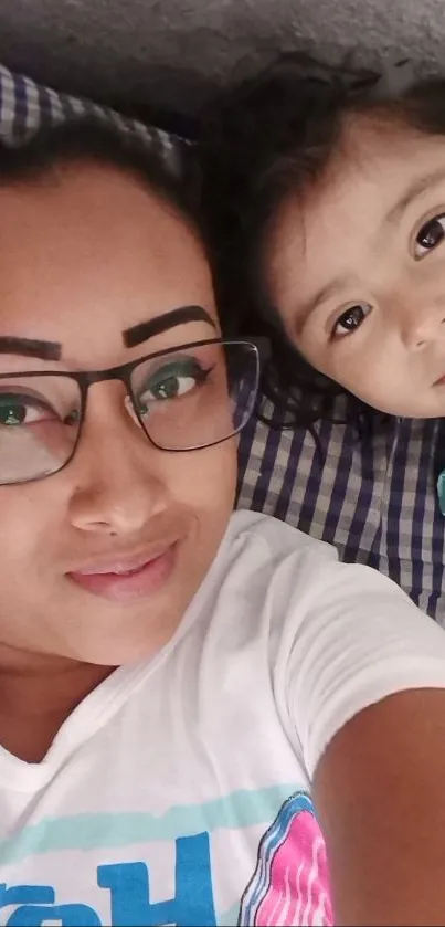 Heartwarming mother and daughter selfie with smiles.