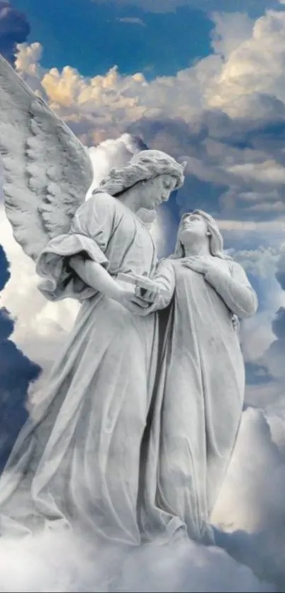 Marble angel statues in a cloud-filled sky.