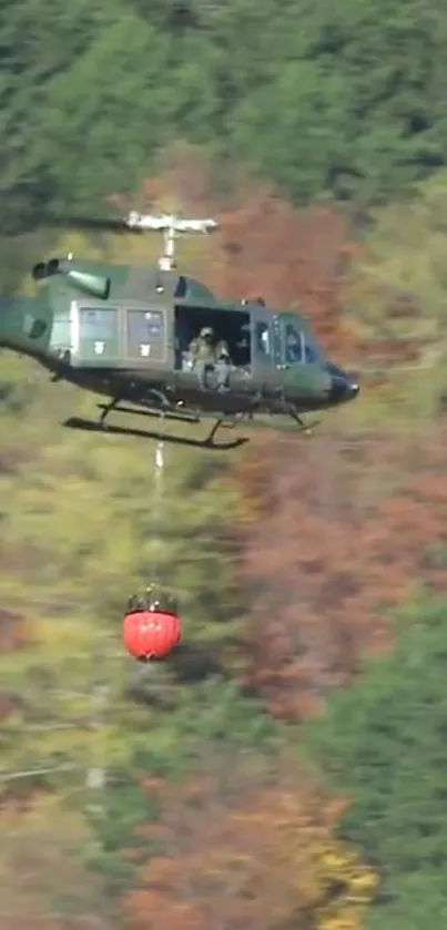 A helicopter flying above a lush green forest landscape.