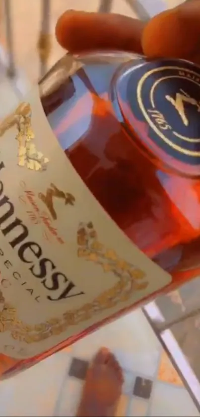 Hennessy Cognac bottle with golden hues, exuding luxury.