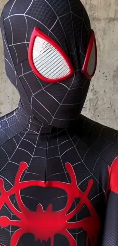 Superhero in black and red suit with web patterns and dynamic stance.