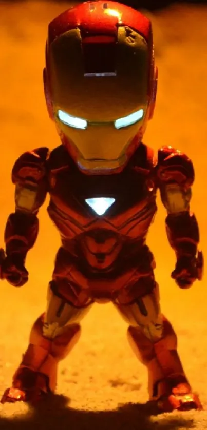 Toy figure resembling hero in desert setting with glowing eyes.