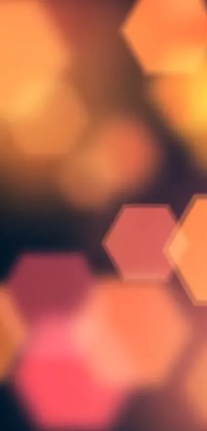 Vibrant hexagon bokeh wallpaper with orange and pink hues.