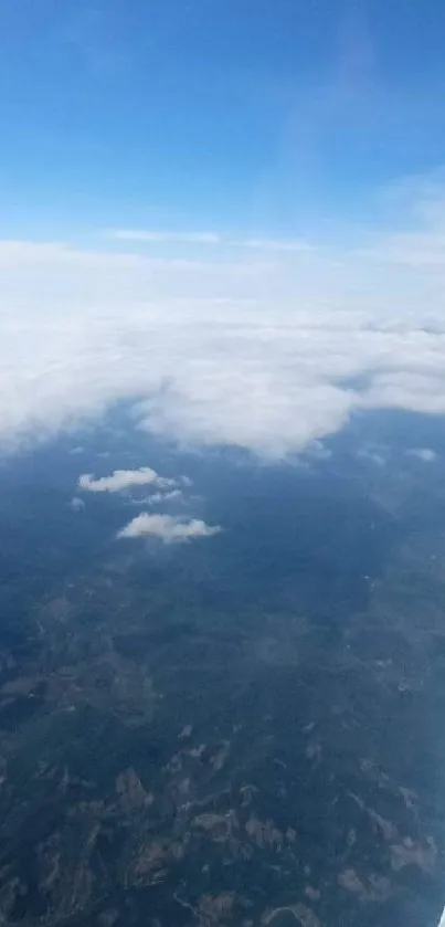 Aerial view of clouds and sky from a plane window, showcasing a peaceful landscape.