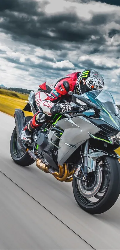 Motorcycle speeding on a wide road under dramatic cloudy skies.