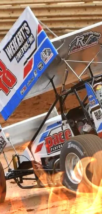 High-speed sprint car on dirt track.