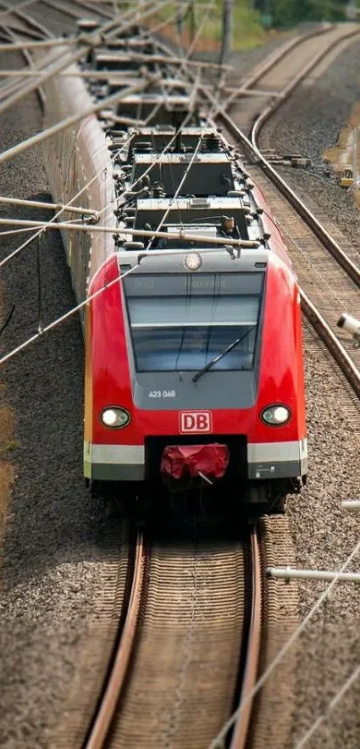 Red high-speed train curving on tracks.