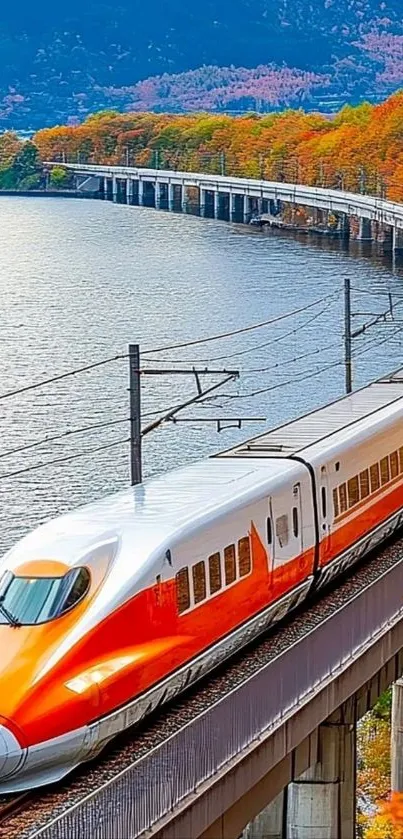High-speed train traversing a scenic autumn landscape over a bridge.
