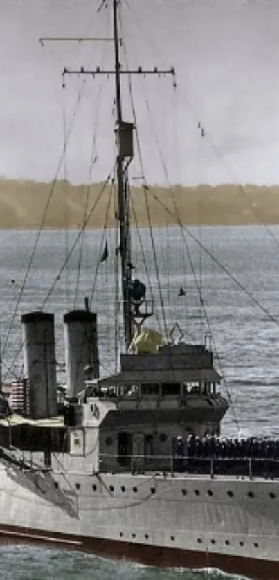 Vintage battleship sailing on the ocean.