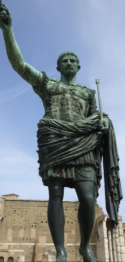 Bronze statue against a clear sky with historic details in the background.