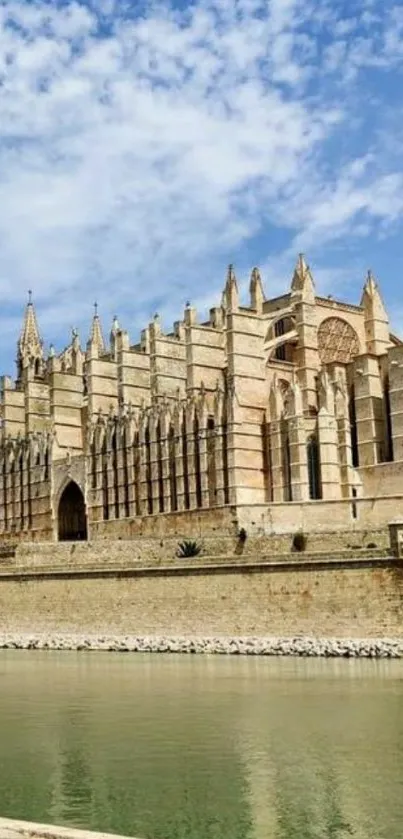 Historic cathedral by the water under a vibrant blue sky, serene and majestic.