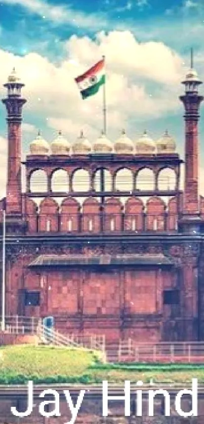 Red Fort with Indian flag under blue sky, iconic Indian monument.