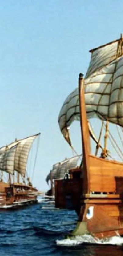 Ancient sailing ships on a blue ocean under clear skies.