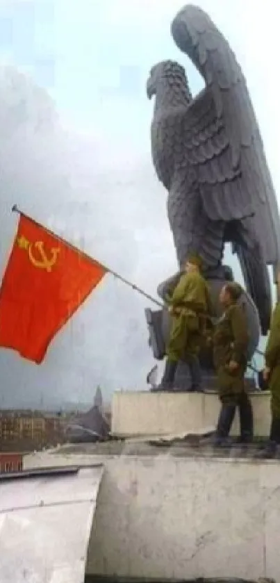 Soviet soldiers raising flag by eagle statue.