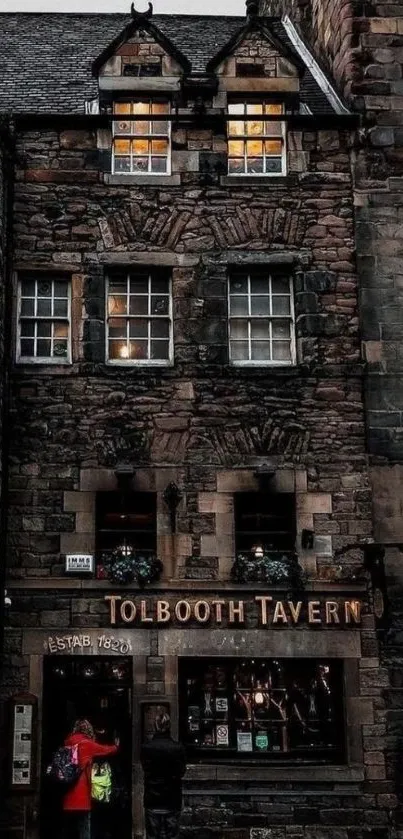 Exterior of historic Tolbooth Tavern at night.