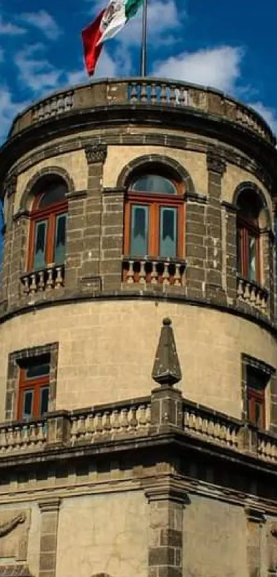 Historic stone tower under a vibrant blue sky.