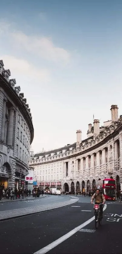 Cyclist on historic London street amidst classic architecture.